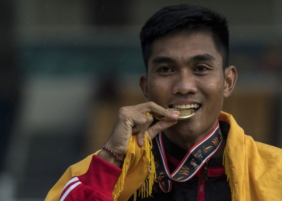 Nusabali.com - medali-emas-ketut-merta-yasa-tak-terkejar-di-atletik