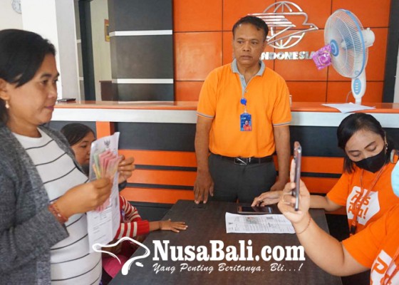 Nusabali.com - kantor-pos-salurkan-bantuan-pkh-dan-bpnt
