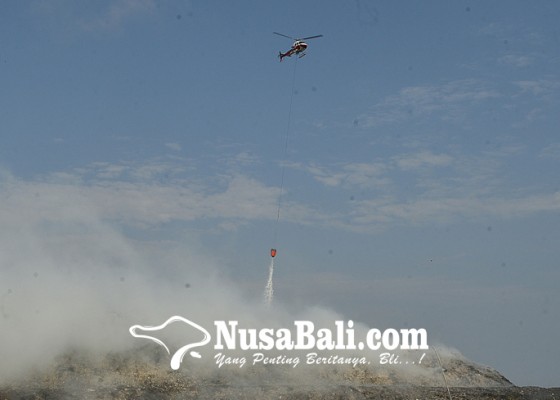 Nusabali.com - heli-water-bombing-dikerahkan-ke-tpa-suwung