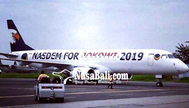 www.nusabali.com-nasdem-for-jokowi-2019-di-badan-pesawat-surya-paloh