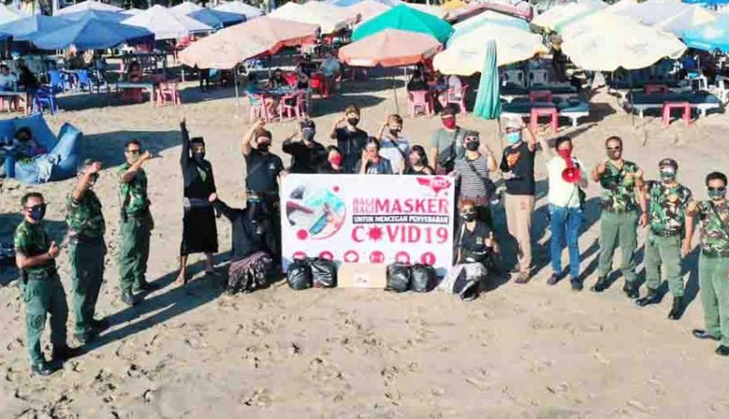 www.nusabali.com-lpm-linmas-dan-masyarakat-bagikan-masker-di-pantai-legian