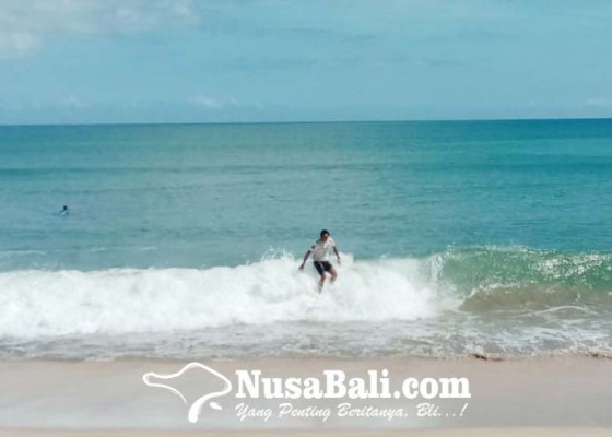 Nusabali.com - puluhan-surfer-hidupkan-pantai-kuta